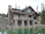 Big Sky Custom Log Home With Incredible Rock Work and Pond