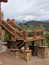 Custom Rock Work on Big Sky Log Home Siding and Pillars to Stairs