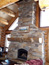 Rock fireplace handcrafted with log mantle, bozeman, mt