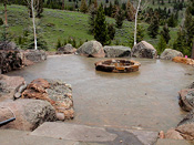 Cement Patio with Custom Rock Fire Pit