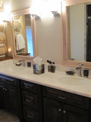 Dark wood bathroom cabinets in Big Sky log home