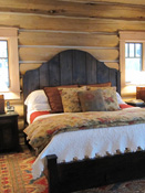 Wood bed in log home, big sky mt