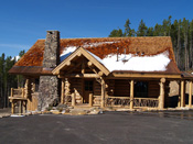 Log Home Enterance With Chimney