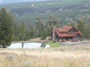 Log Home From Distance, Big Sky MT