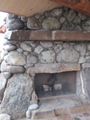 Outside fireplace on log home, Big Sky MT